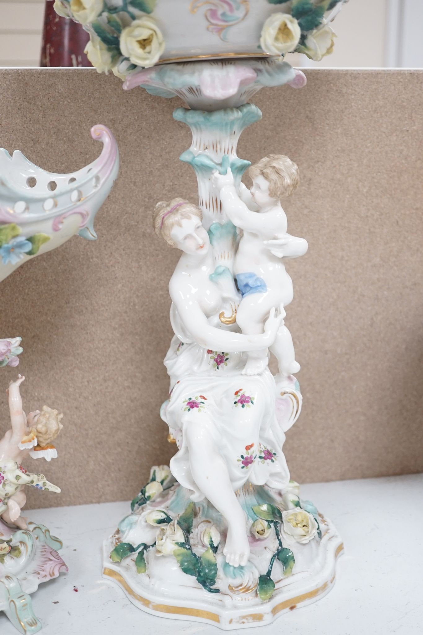 A tall German porcelain figural centrepiece bowl and two others smaller. Tallest 47cm